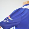 เสื้อทีมชาติไทย เสื้ออุ่นเครื่องทีมชาติไทย เสื้อแข่งทีมชาติไทย ปี 2012-2013 แกรนด์สปอร์ต (Grand Sport) ชุดเกมส์อุ่นเครือง สีน้ำเงิน