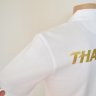 เสื้อโปโลทีมชาติไทย Grand Sport ปี 2012 สีขาว สกรีน THAILAND สีทอง